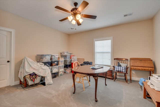 home office featuring a ceiling fan and carpet flooring