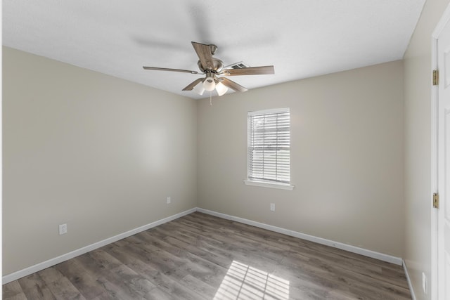 empty room with light hardwood / wood-style floors and ceiling fan