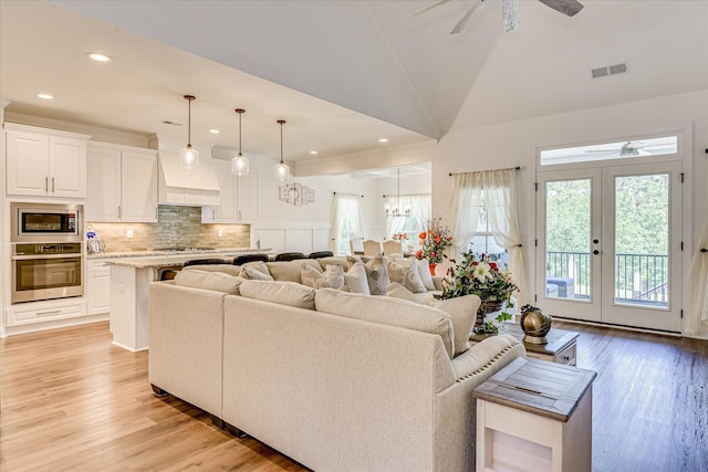 670 Callaway Dr, Graniteville, SC 29829 - living area with ceiling fan, light wood finished floors, lofted ceiling, recessed lighting, and french doors