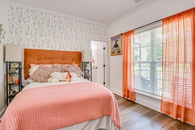 670 Callaway Dr, Graniteville, SC 29829 - bedroom featuring wallpapered walls, an accent wall, crown molding, wood finished floors, and baseboards