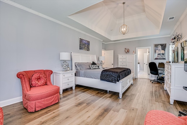 670 Callaway Dr, Graniteville, SC 29829 - bedroom featuring a tray ceiling, light wood-style floors, crown molding, a chandelier, and an office area