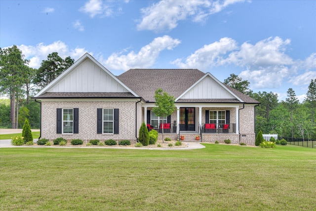 670 Callaway Dr, Graniteville, SC 29829 - view of front of home with board and batten siding, brick siding, a porch, and a front yard
