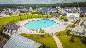 view of swimming pool with a patio area and a lawn