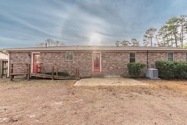 back of property featuring central air condition unit and a patio area