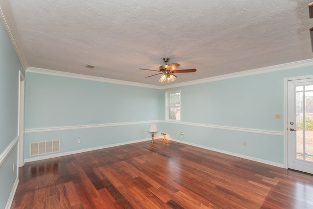 empty room featuring dark hardwood / wood-style floors, ceiling fan, and crown molding