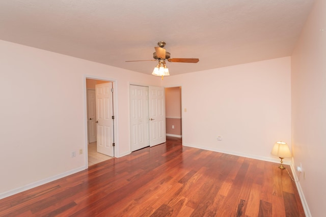 unfurnished bedroom with hardwood / wood-style flooring and ceiling fan