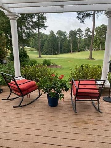 wooden deck with a yard