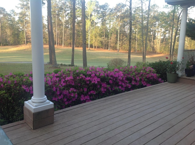 wooden deck with a yard