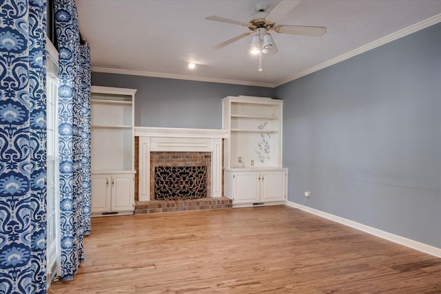 living room with ceiling fan, light hardwood / wood-style flooring, crown molding, and a brick fireplace