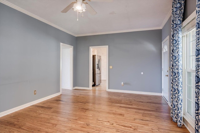 unfurnished room with ceiling fan, light wood-type flooring, and crown molding