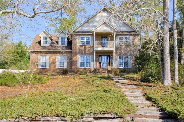 view of front of property with a balcony