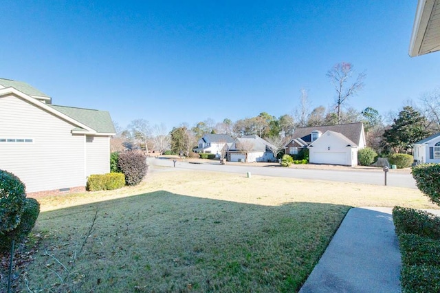 view of yard featuring a garage