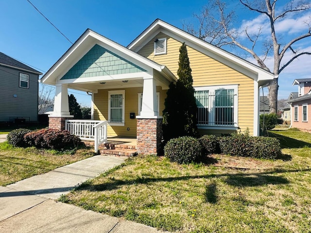 view of front facade with a porch and a front yard