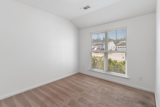 7058 Summerton Dr, Augusta, GA 30909 - carpeted spare room featuring visible vents, baseboards, and vaulted ceiling