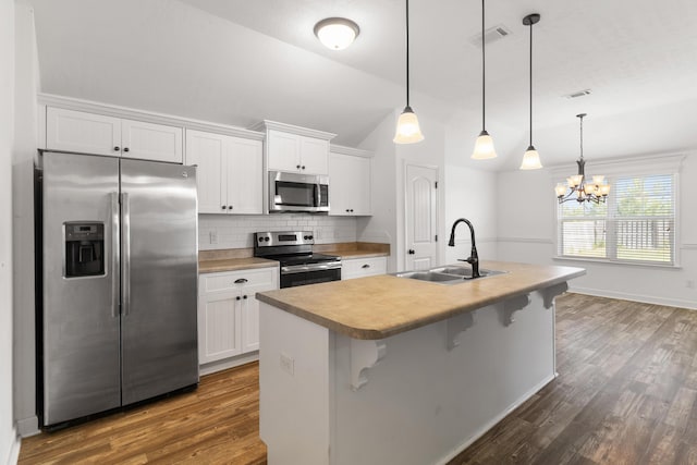 7058 Summerton Dr, Augusta, GA 30909 - kitchen featuring a sink, dark wood-style flooring, appliances with stainless steel finishes, and white cabinetry