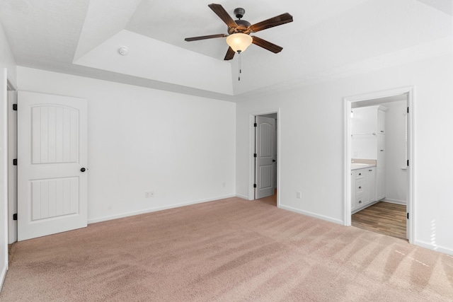 7058 Summerton Dr, Augusta, GA 30909 - unfurnished bedroom with light colored carpet, a raised ceiling, and baseboards