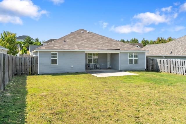 7058 Summerton Dr, Augusta, GA 30909 - back of property with a fenced backyard, a yard, a patio area, and roof with shingles