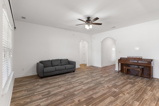 7058 Summerton Dr, Augusta, GA 30909 - unfurnished room featuring visible vents, wood finished floors, baseboards, ceiling fan, and arched walkways