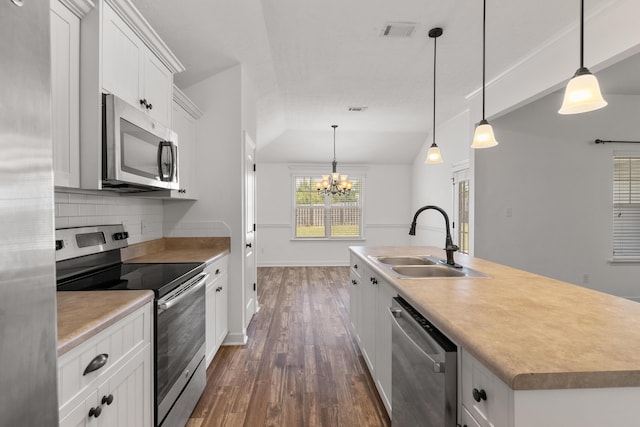 7058 Summerton Dr, Augusta, GA 30909 - kitchen with decorative backsplash, visible vents, appliances with stainless steel finishes, a sink, and dark wood-type flooring