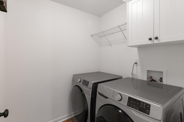 7058 Summerton Dr, Augusta, GA 30909 - washroom featuring cabinet space and washing machine and clothes dryer