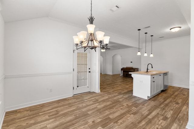 7058 Summerton Dr, Augusta, GA 30909 - kitchen featuring visible vents, a sink, open floor plan, arched walkways, and dishwasher