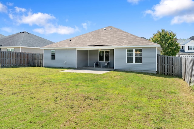 7058 Summerton Dr, Augusta, GA 30909 - back of property with a yard, roof with shingles, a fenced backyard, and a patio area