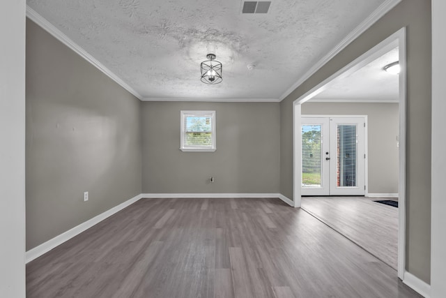 3808 Southfield Dr, Augusta, GA 30906 - spare room with wood finished floors, baseboards, french doors, a textured ceiling, and crown molding