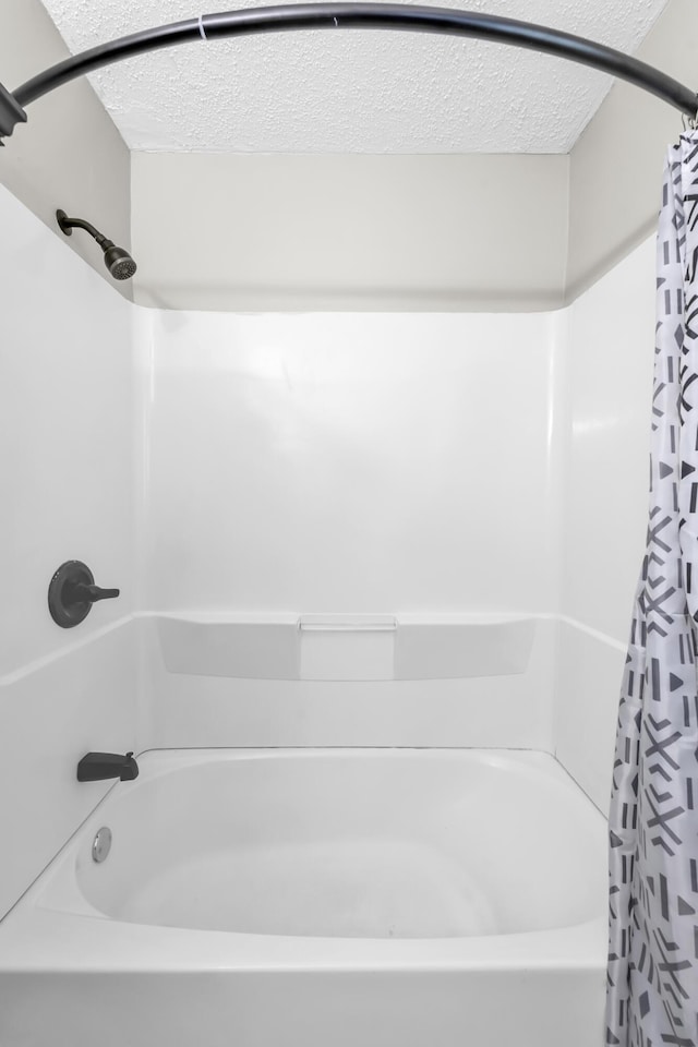 3808 Southfield Dr, Augusta, GA 30906 - bathroom with a textured ceiling and shower / tub combo