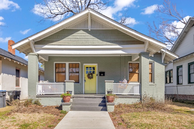 view of front of property featuring covered porch