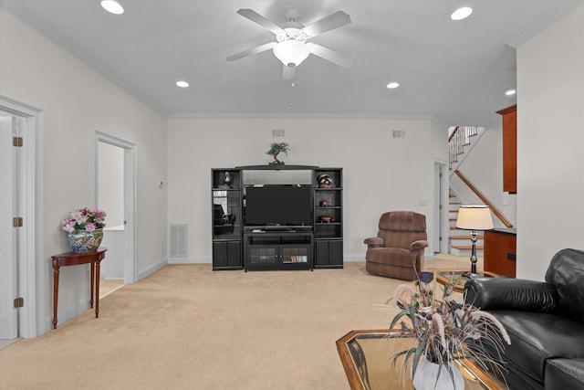 living area featuring light carpet, visible vents, stairs, and crown molding