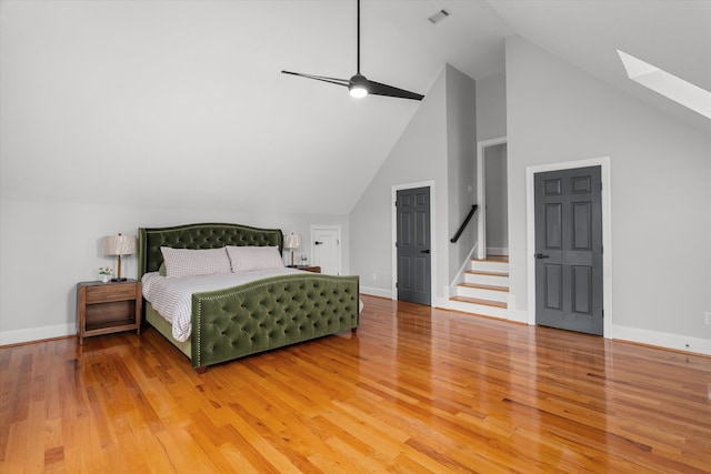 1423 Knob Hill Cir, Evans, GA 30809 - bedroom with a skylight, light wood-type flooring, baseboards, and high vaulted ceiling
