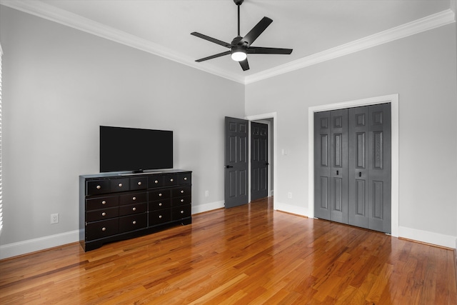 1423 Knob Hill Cir, Evans, GA 30809 - unfurnished bedroom featuring ornamental molding, light wood-style flooring, baseboards, ceiling fan, and a closet