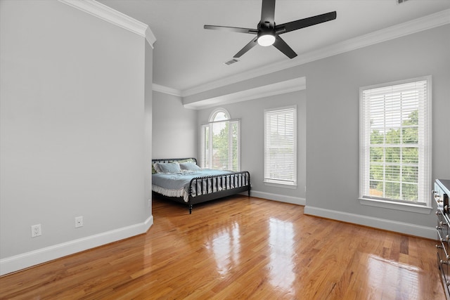 1423 Knob Hill Cir, Evans, GA 30809 - bedroom featuring crown molding, baseboards, multiple windows, light wood-style floors, and ceiling fan