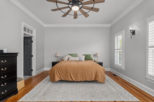 1423 Knob Hill Cir, Evans, GA 30809 - bedroom with wood finished floors, crown molding, baseboards, and a ceiling fan
