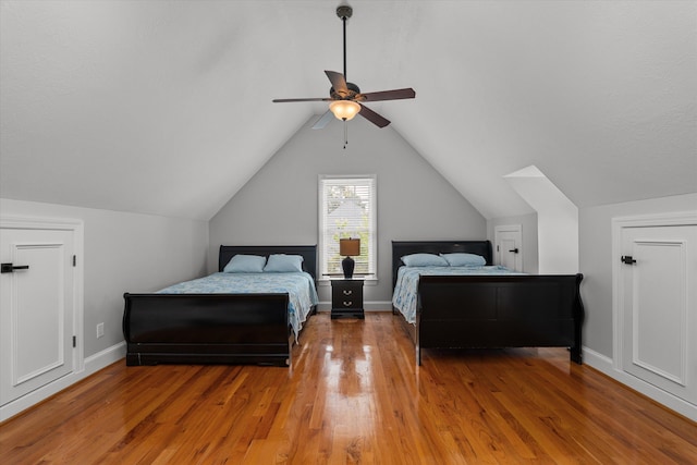 1423 Knob Hill Cir, Evans, GA 30809 - bedroom featuring light wood-style floors, vaulted ceiling, a ceiling fan, and baseboards