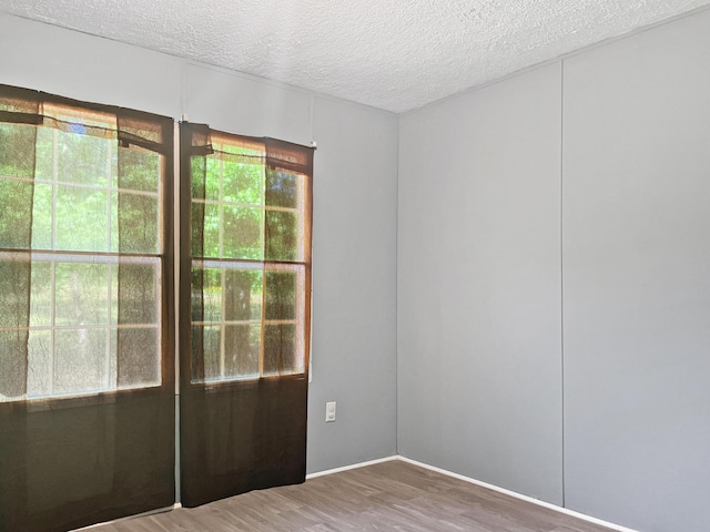 4112 Quail Farm Rd, Thomson, GA 30824 - spare room featuring a textured ceiling and wood finished floors