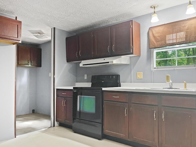 4112 Quail Farm Rd, Thomson, GA 30824 - kitchen featuring light countertops, under cabinet range hood, a textured ceiling, and black electric range oven