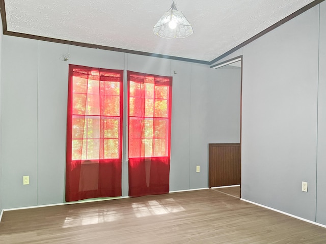4112 Quail Farm Rd, Thomson, GA 30824 - spare room featuring a textured ceiling and wood finished floors