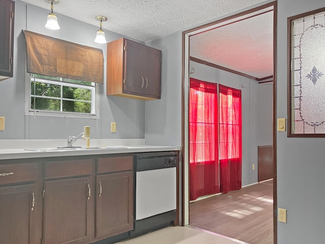 4112 Quail Farm Rd, Thomson, GA 30824 - kitchen with light countertops, a textured ceiling, a sink, and dishwasher