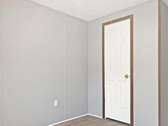 4112 Quail Farm Rd, Thomson, GA 30824 - empty room with a textured ceiling and wood finished floors