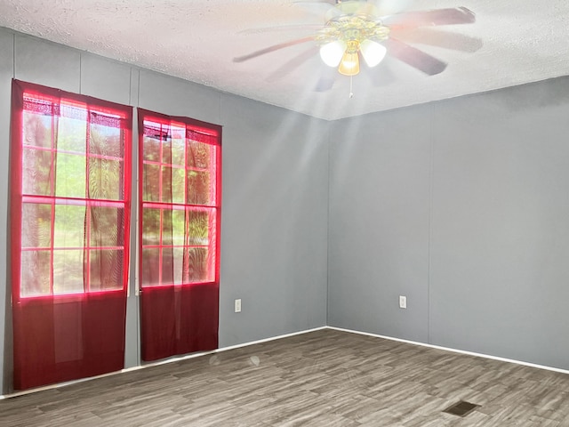 4112 Quail Farm Rd, Thomson, GA 30824 - spare room with a ceiling fan, a textured ceiling, and wood finished floors