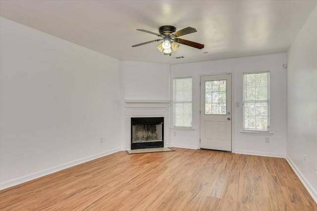 unfurnished living room with ceiling fan and light hardwood / wood-style floors