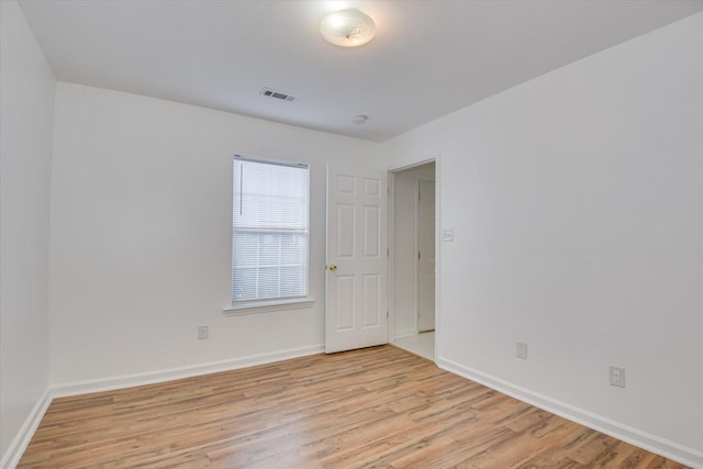 unfurnished room featuring light hardwood / wood-style flooring