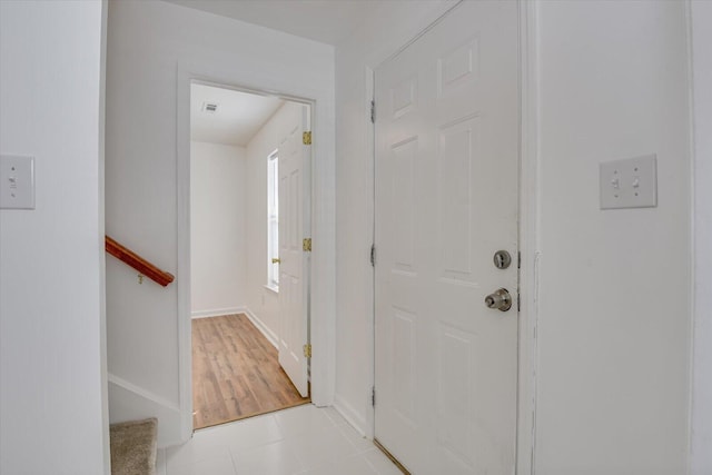 interior space featuring light tile patterned flooring