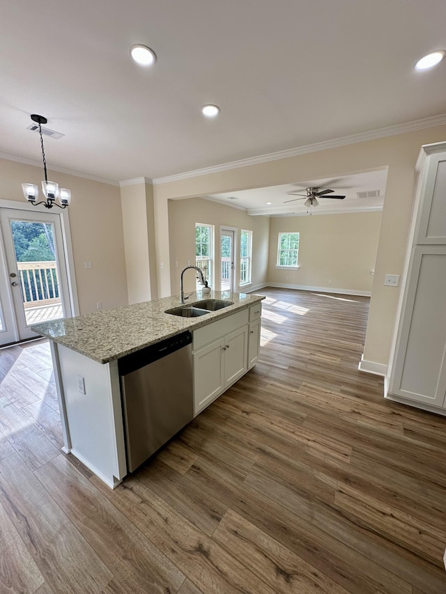 kitchen with a sink, dark wood finished floors, dishwasher, and ornamental molding