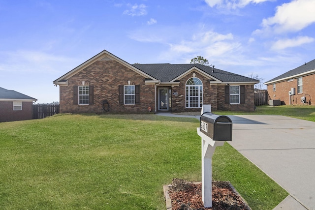 ranch-style house featuring central AC and a front lawn