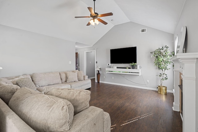 living room featuring dark hardwood / wood-style flooring, lofted ceiling, a fireplace, and ceiling fan