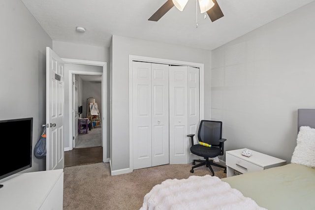 bedroom featuring a closet, ceiling fan, and carpet