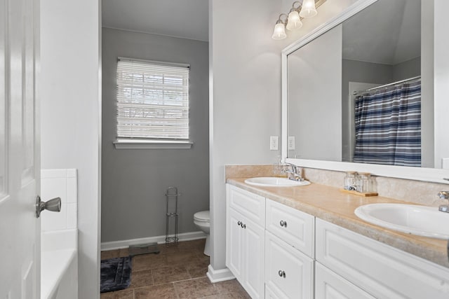 bathroom with vanity, tile patterned flooring, a shower with curtain, and toilet