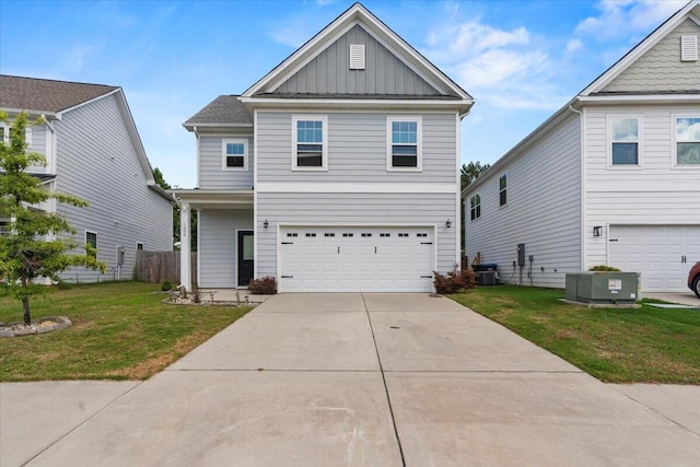 1404 Feldspar Ct, Augusta, GA 30909 - view of front of property featuring board and batten siding, a garage, a front yard, and concrete driveway